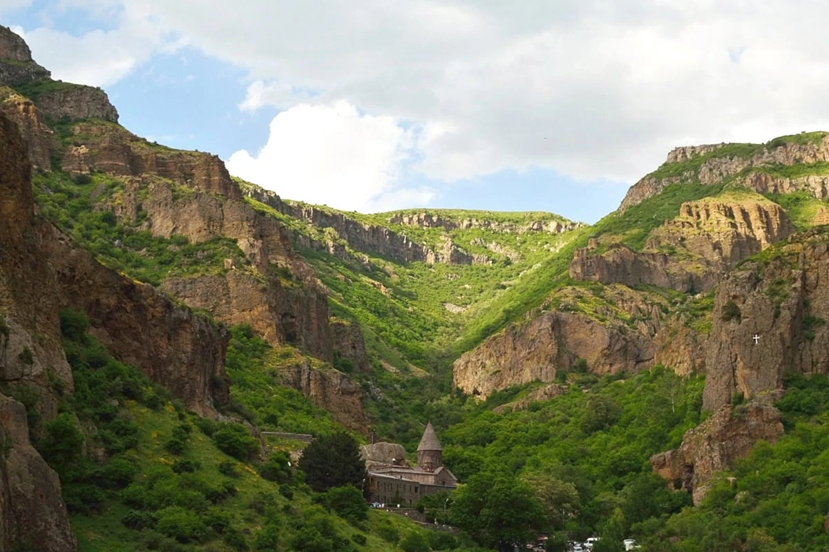 Armenia Ecotourism: Your Guide to Farms, Vineyards & Villages: Geghard Monastery nestled within the dramatic cliffs of the Azat River Gorge